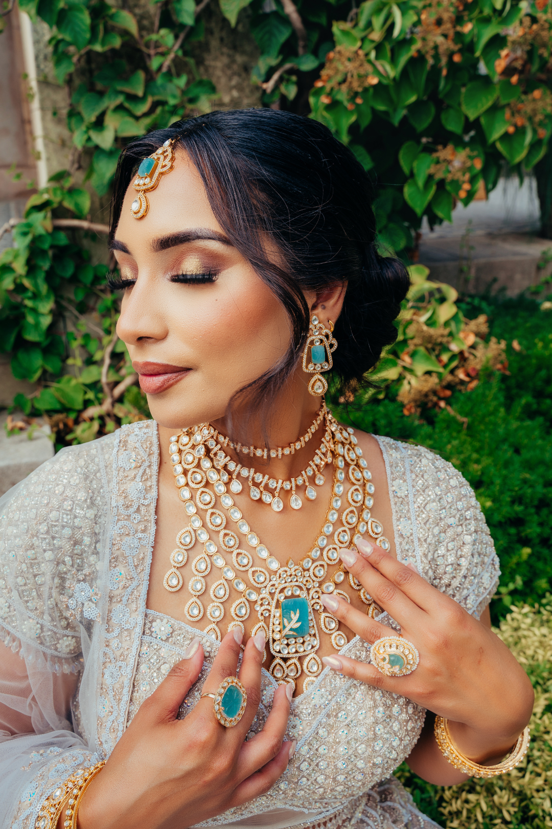Siham Indian bridal jewelry set with moissanite polki stones, gold plating, turquoise centerpiece, and green accents