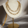 Siri Minimal Gold Plated Moissanite Polki Necklace Set with a double-strand design and matching floral pattern stud earrings.