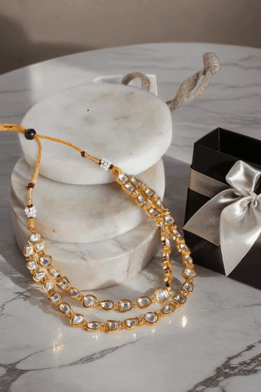 Siri Minimal Gold Plated Moissanite Polki Necklace Set with a double-strand design and matching floral pattern stud earrings.