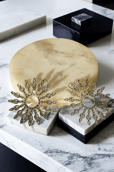 Starburst Statement Earrings with rhodium plating and pavé stones on a gold stand; 2.3-inch oversized studs with secure hook backs for elegance.