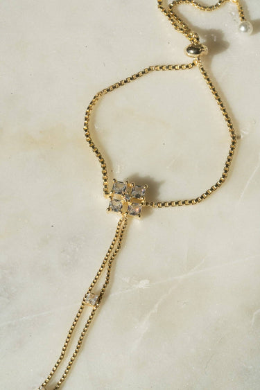 Soraya hand chain bracelet in gold plating with cubic stones