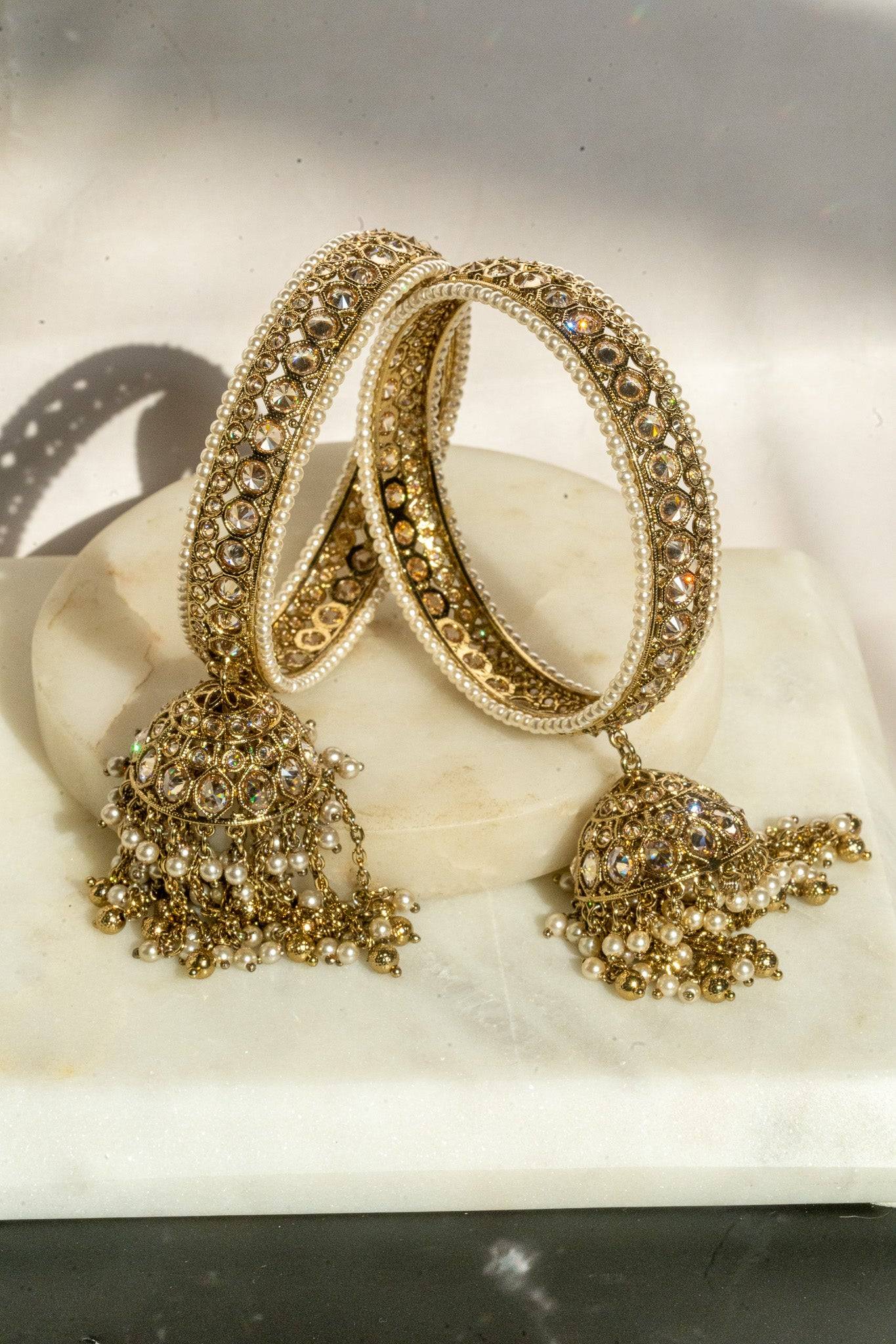 Antique mehendi gold bangle set with reverse AD stones and jhumka tassels from Inaury