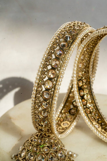 Antique mehendi gold bangle set with reverse AD stones and jhumka tassels from Inaury