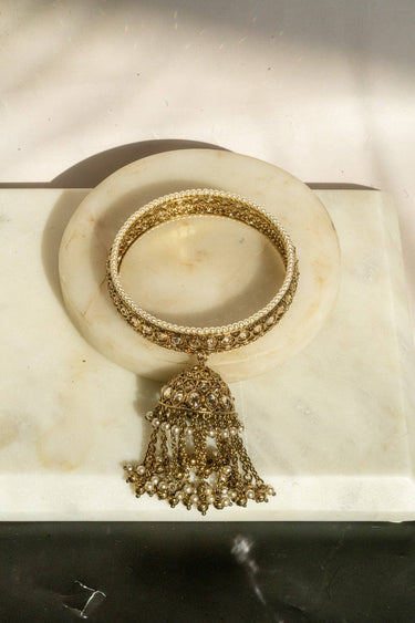 Antique mehendi gold bangle set with reverse AD stones and jhumka tassels from Inaury
