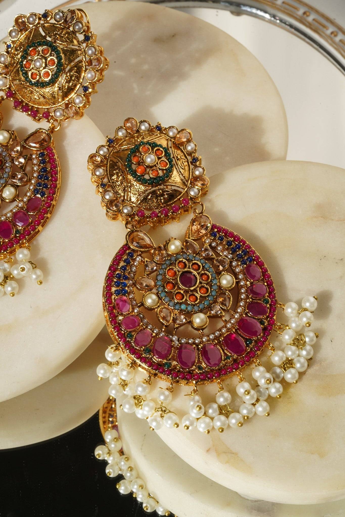 Zoomed view of Adiva Earrings showcasing gold filigree, colorful stones, and pearl embellishments.