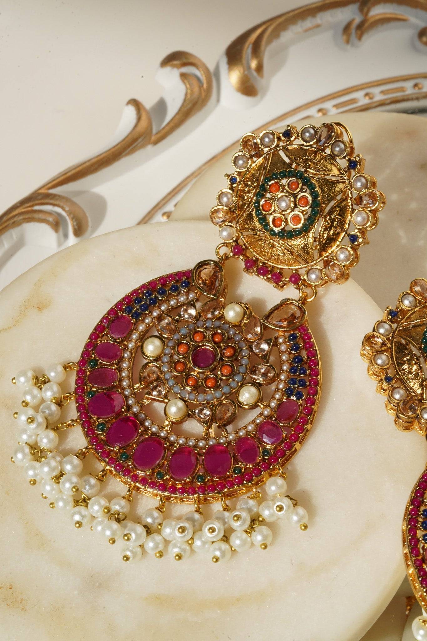 Close-up of Adiva Earring top and pendant with intricate multi-color stone design and pearl fringe.