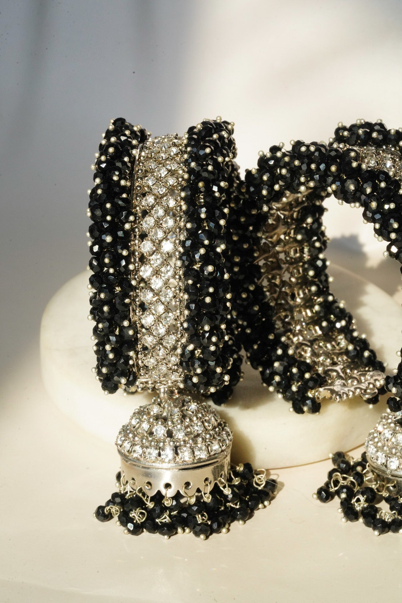 Aliya Handcrafted Bangle Bracelet - Available in silver and faux pearls, gold and faux pearls, silver and black, gold and black, gold and maroon, and silver and pink, with hanging jhumka.