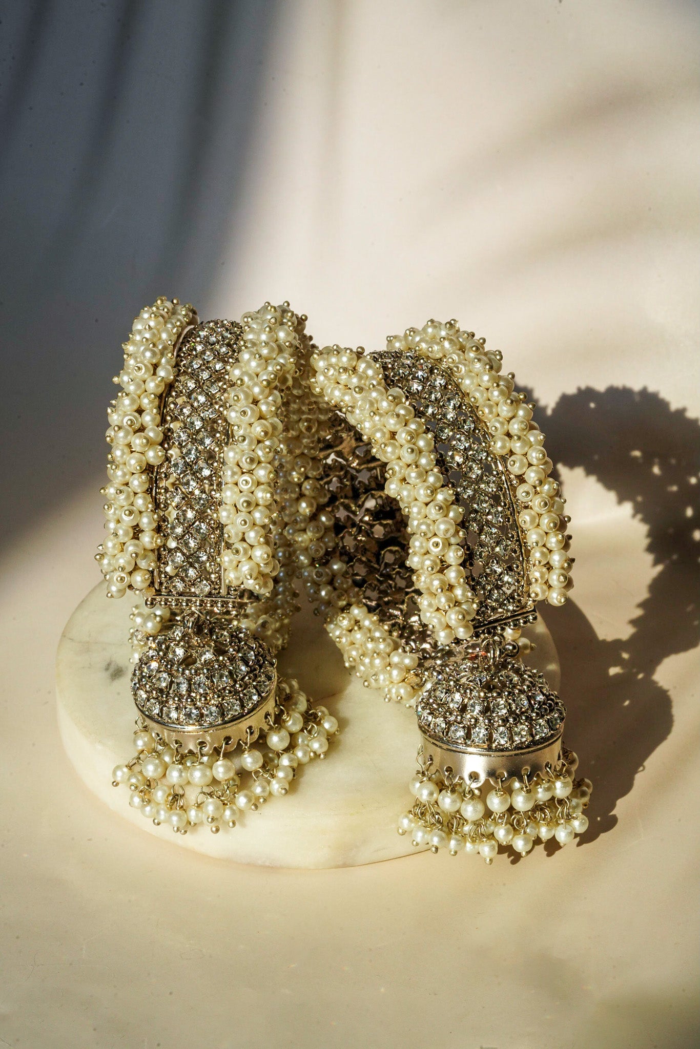 Aliya Handcrafted Bangle Bracelet - Available in silver and faux pearls, gold and faux pearls, silver and black, gold and black, gold and maroon, and silver and pink, with hanging jhumka.