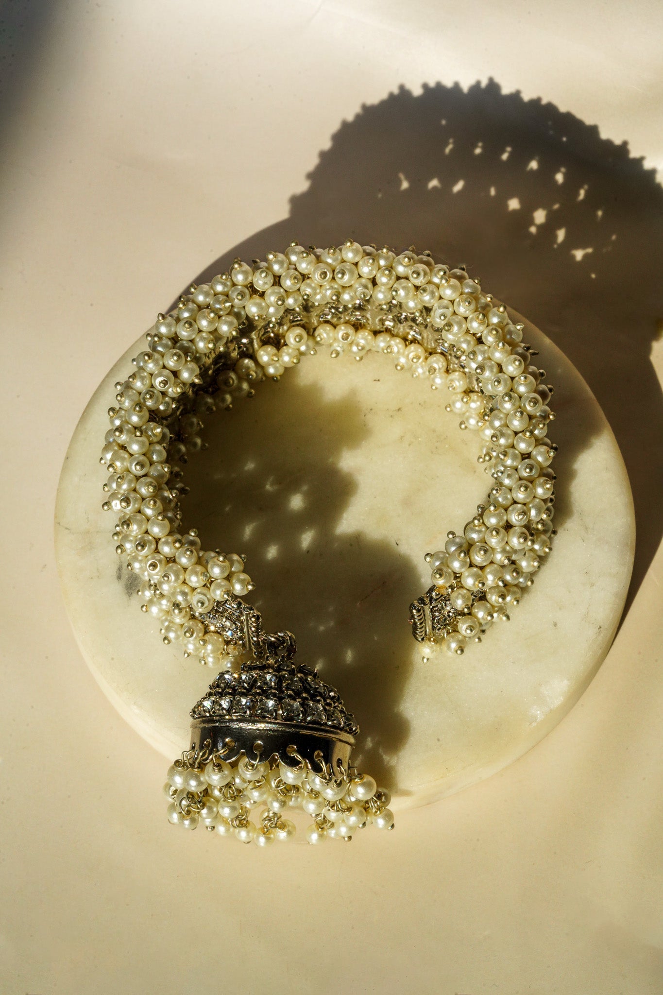 Aliya Handcrafted Bangle Bracelet - Available in silver and faux pearls, gold and faux pearls, silver and black, gold and black, gold and maroon, and silver and pink, with hanging jhumka.