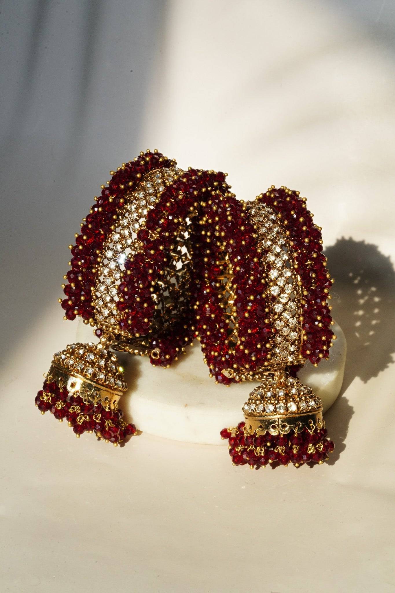 Aliya Handcrafted Bangle Bracelet - Available in silver and faux pearls, gold and faux pearls, silver and black, gold and black, gold and maroon, and silver and pink, with hanging jhumka.