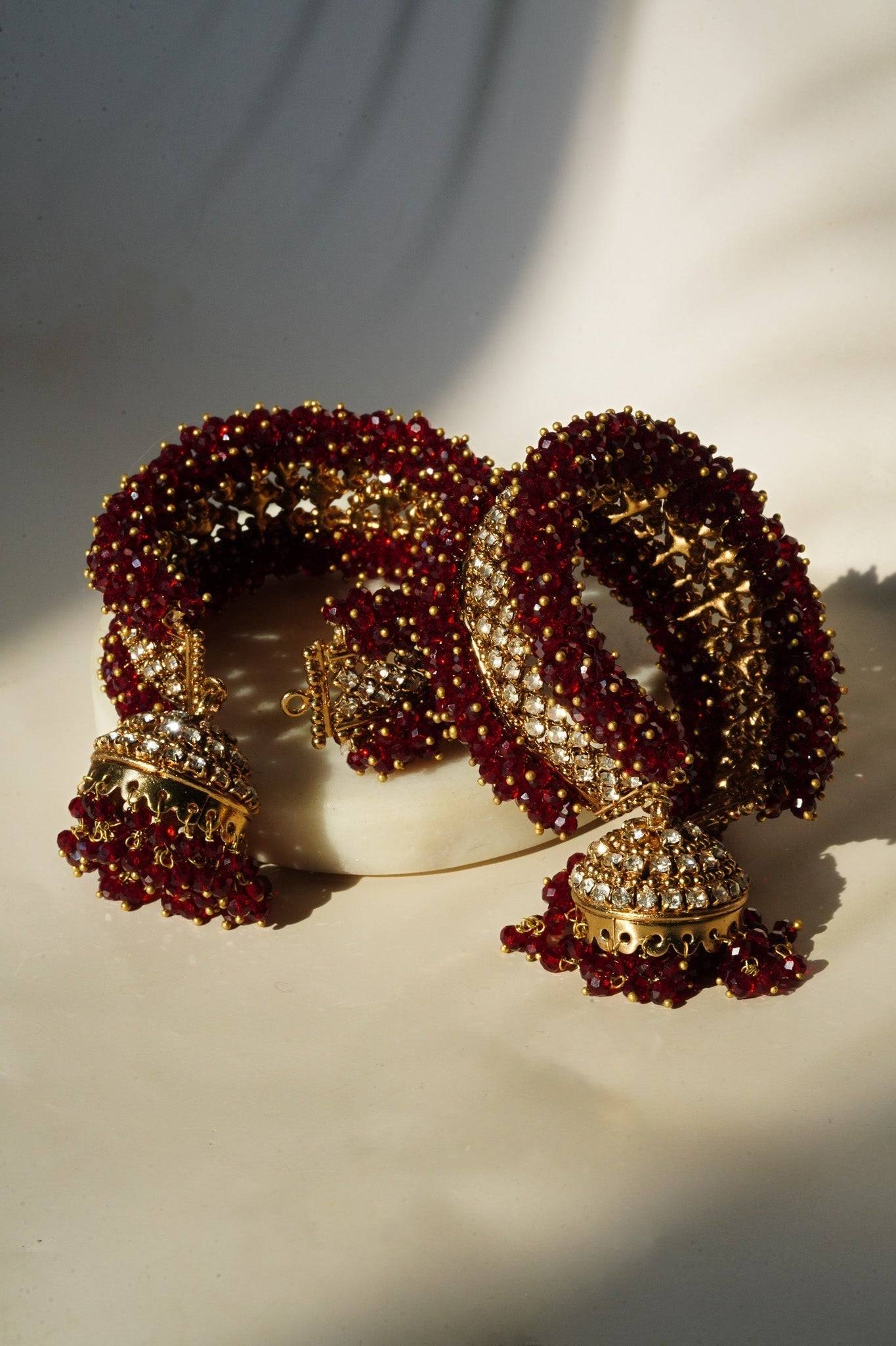 Aliya Handcrafted Bangle Bracelet - Available in silver and faux pearls, gold and faux pearls, silver and black, gold and black, gold and maroon, and silver and pink, with hanging jhumka.