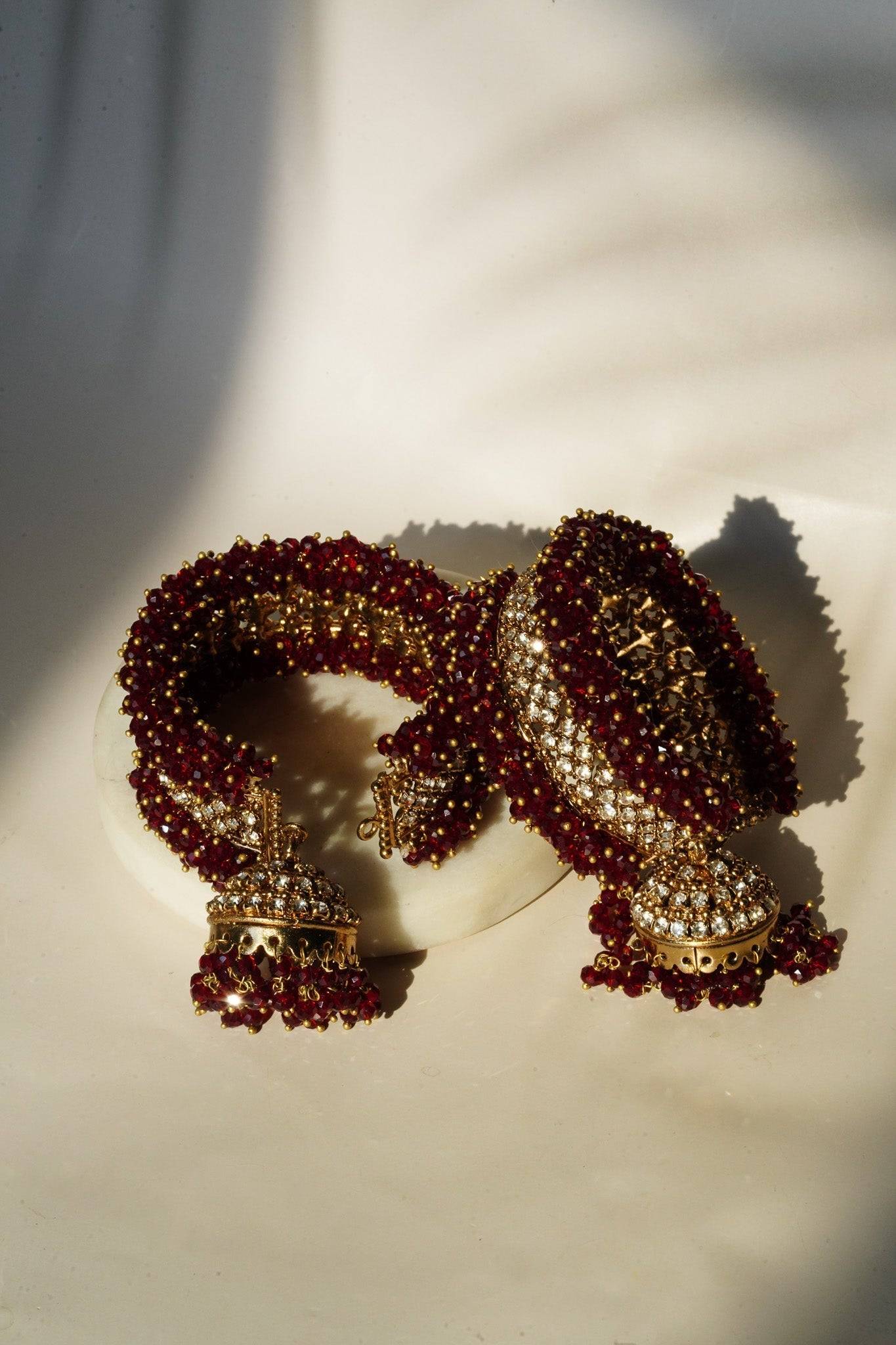 Aliya Handcrafted Bangle Bracelet - Available in silver and faux pearls, gold and faux pearls, silver and black, gold and black, gold and maroon, and silver and pink, with hanging jhumka.