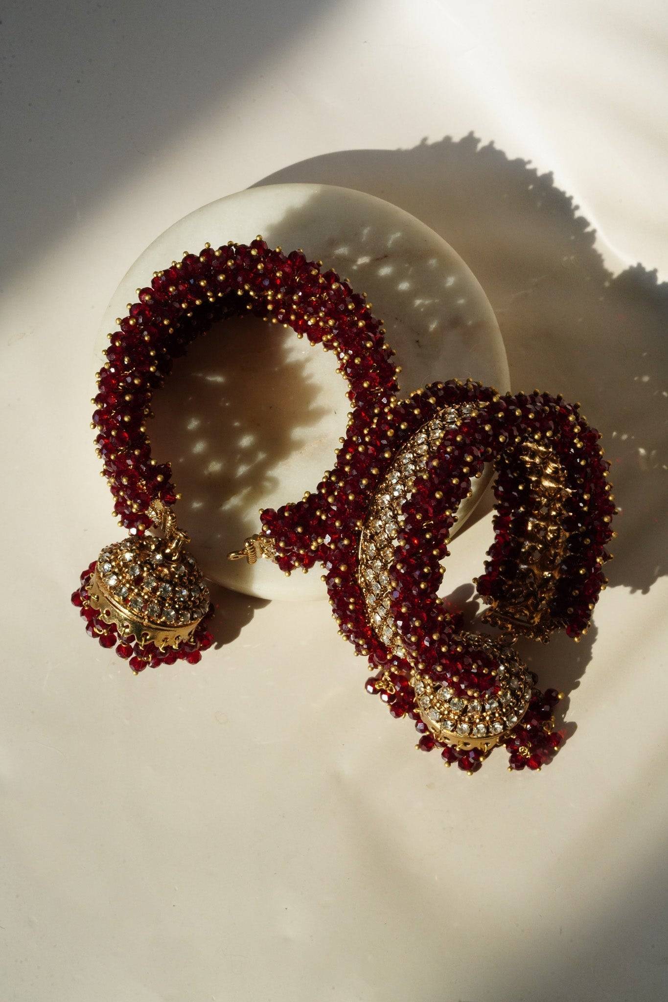 Aliya Handcrafted Bangle Bracelet - Available in silver and faux pearls, gold and faux pearls, silver and black, gold and black, gold and maroon, and silver and pink, with hanging jhumka.