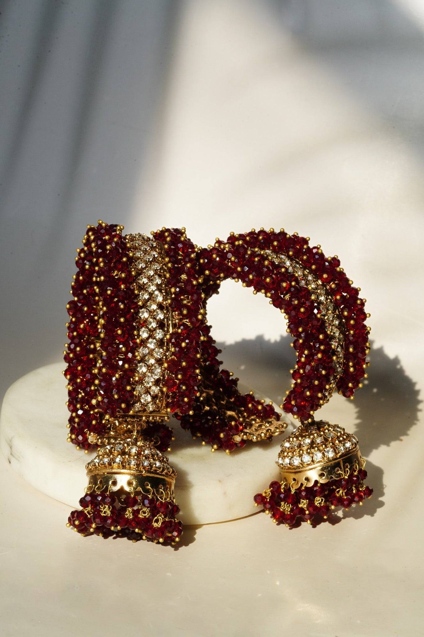 Aliya Handcrafted Bangle Bracelet - Available in silver and faux pearls, gold and faux pearls, silver and black, gold and black, gold and maroon, and silver and pink, with hanging jhumka.