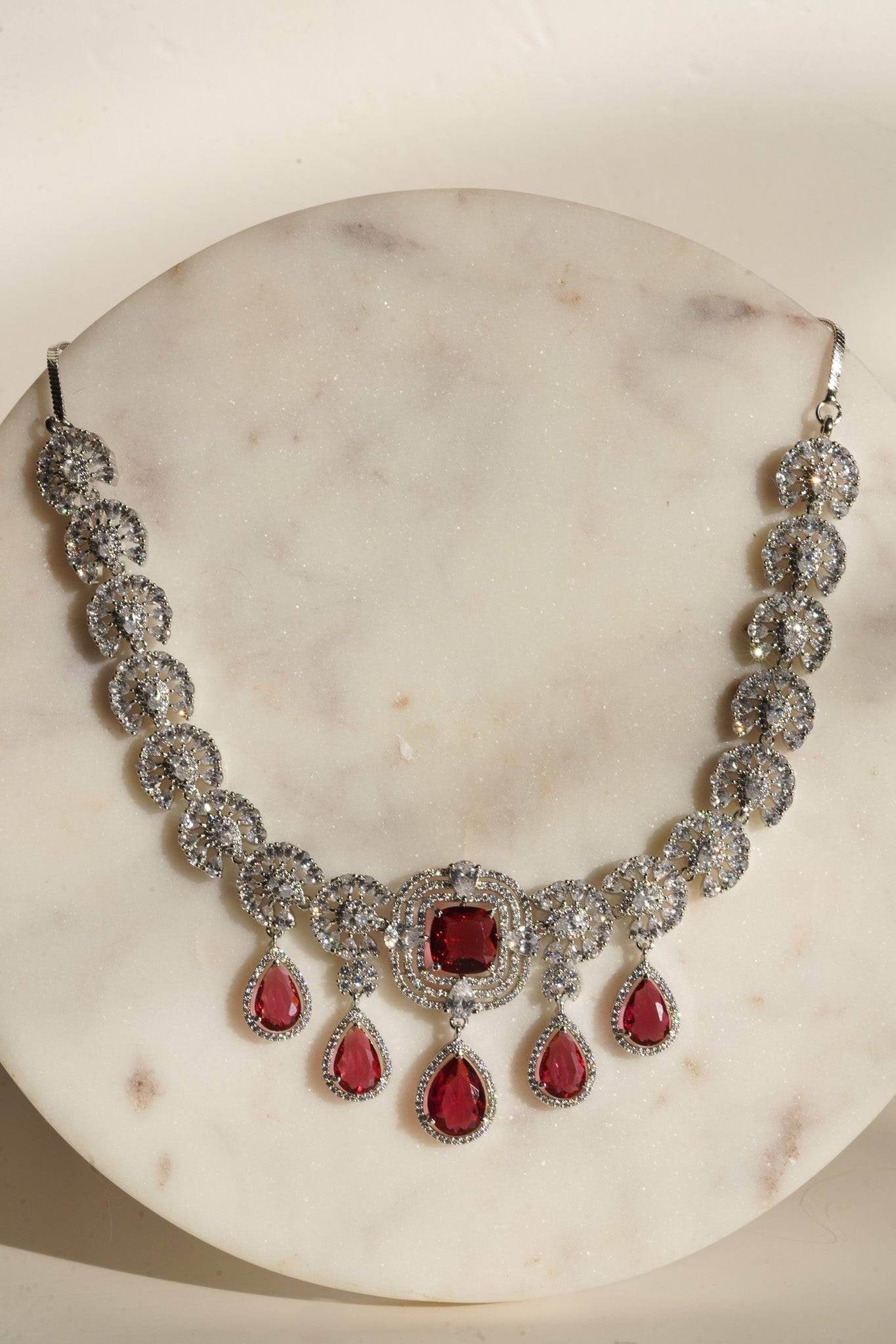 Aneesha Diamante Accent AD Necklace Set - Rhodium-finished with emerald green, maroon, or dusty pink accents, featuring a statement necklace and matching earrings.