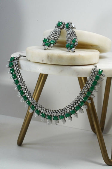Side angle of green Anjam Black Plated AD Necklace Set, highlighting the symmetrical CZ stonework and black plating.