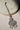 Rhodium-plated floral maang tikka with AD stones in a silver and white from Inaury