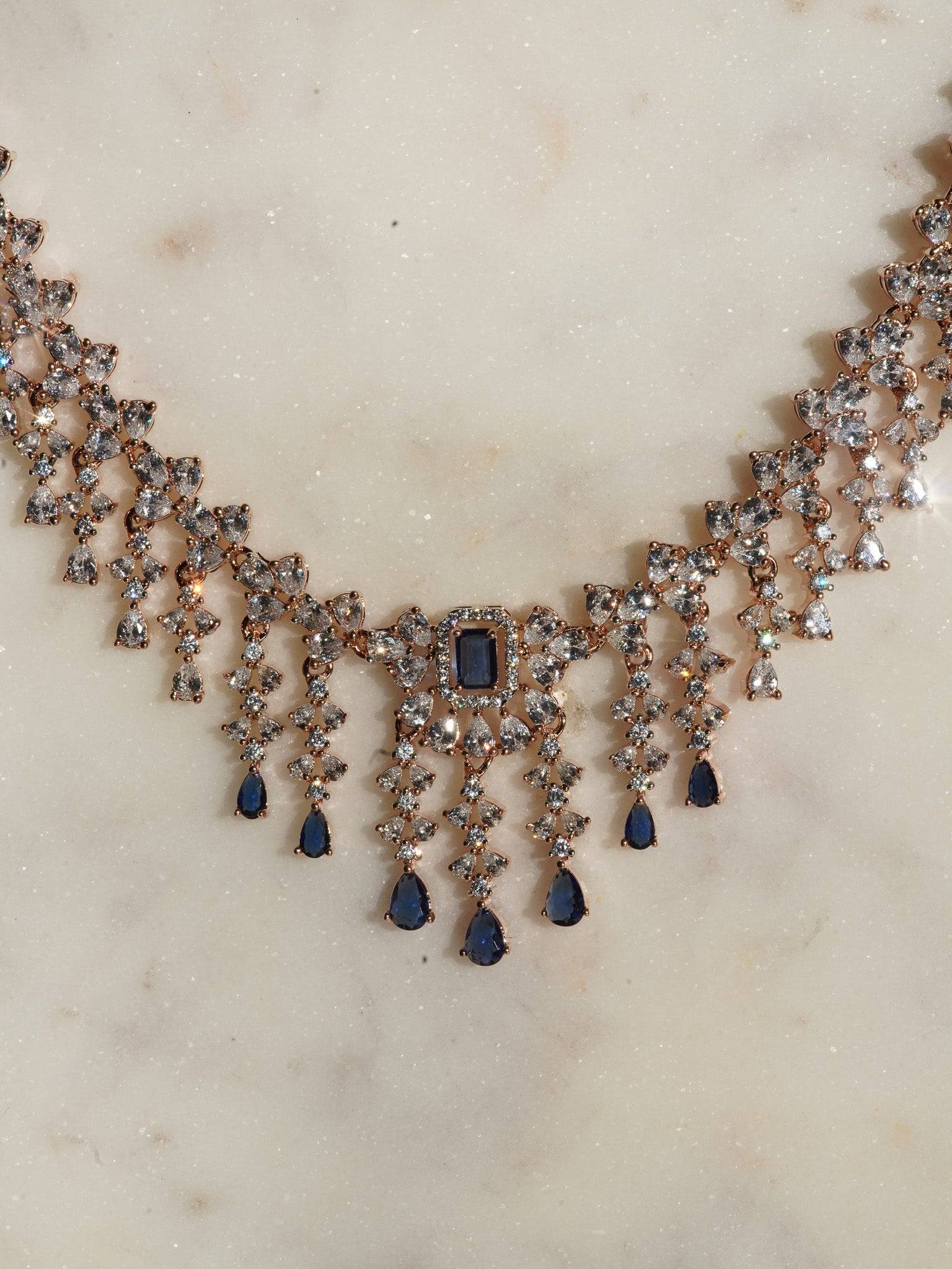Anne Diamante Accent AD Necklace Set - Rose gold plated with cascading design, featuring diamante accent AD stones and matching dainty earrings, available in rose gold & white, rose gold & pink, rose gold & green, rose gold & sapphire blue, and rose gold & maroon.