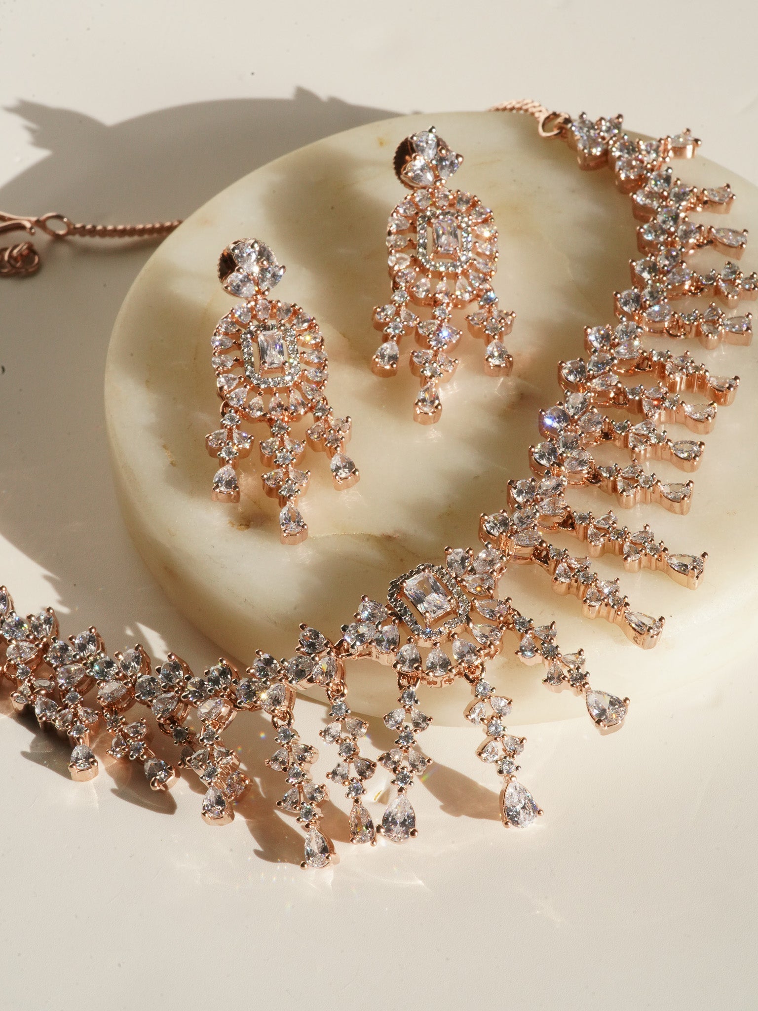 Anne Diamante Accent AD Necklace Set - Rose gold plated with cascading design, featuring diamante accent AD stones and matching dainty earrings, available in rose gold & white, rose gold & pink, rose gold & green, rose gold & sapphire blue, and rose gold & maroon.