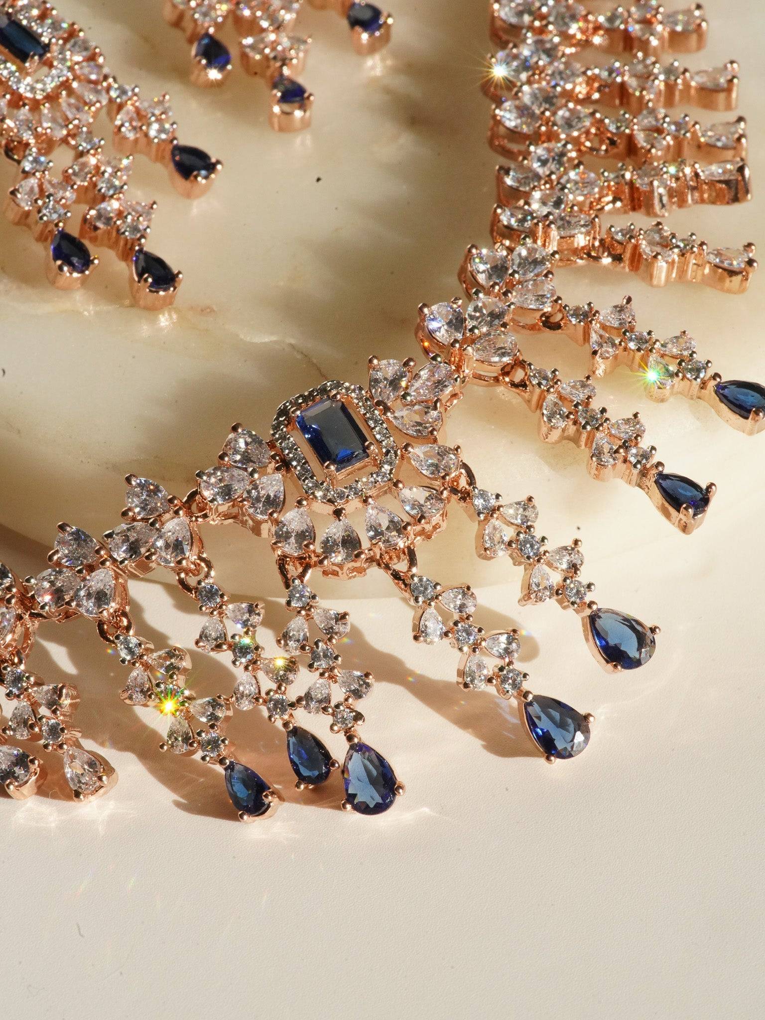 Anne Diamante Accent AD Necklace Set - Rose gold plated with cascading design, featuring diamante accent AD stones and matching dainty earrings, available in rose gold & white, rose gold & pink, rose gold & green, rose gold & sapphire blue, and rose gold & maroon.
