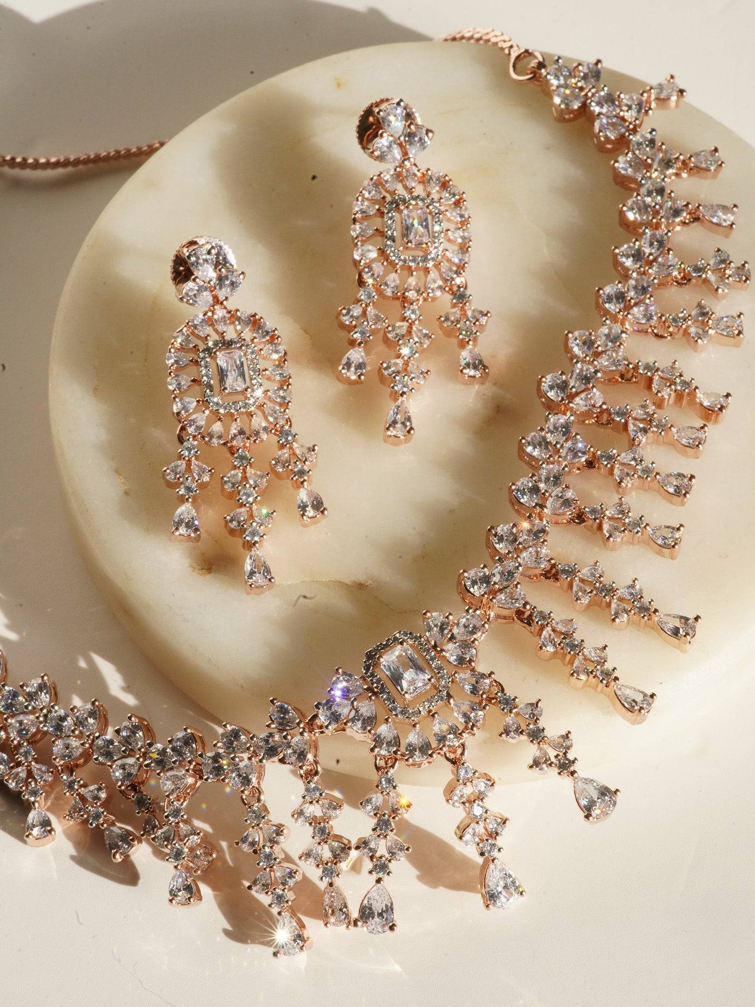 Anne Diamante Accent AD Necklace Set - Rose gold plated with cascading design, featuring diamante accent AD stones and matching dainty earrings, available in rose gold & white, rose gold & pink, rose gold & green, rose gold & sapphire blue, and rose gold & maroon.