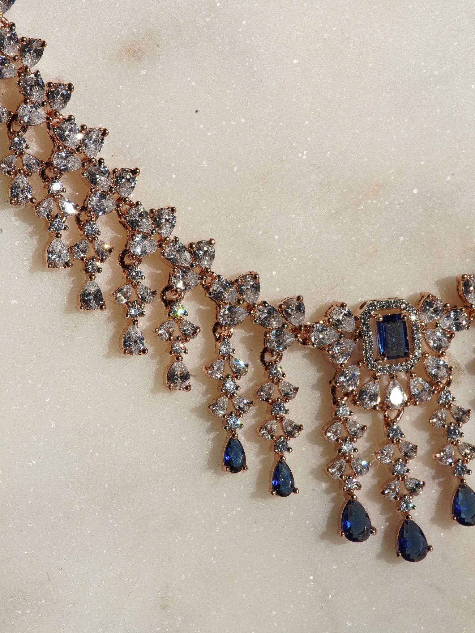 Anne Diamante Accent AD Necklace Set - Rose gold plated with cascading design, featuring diamante accent AD stones and matching dainty earrings, available in rose gold & white, rose gold & pink, rose gold & green, rose gold & sapphire blue, and rose gold & maroon.