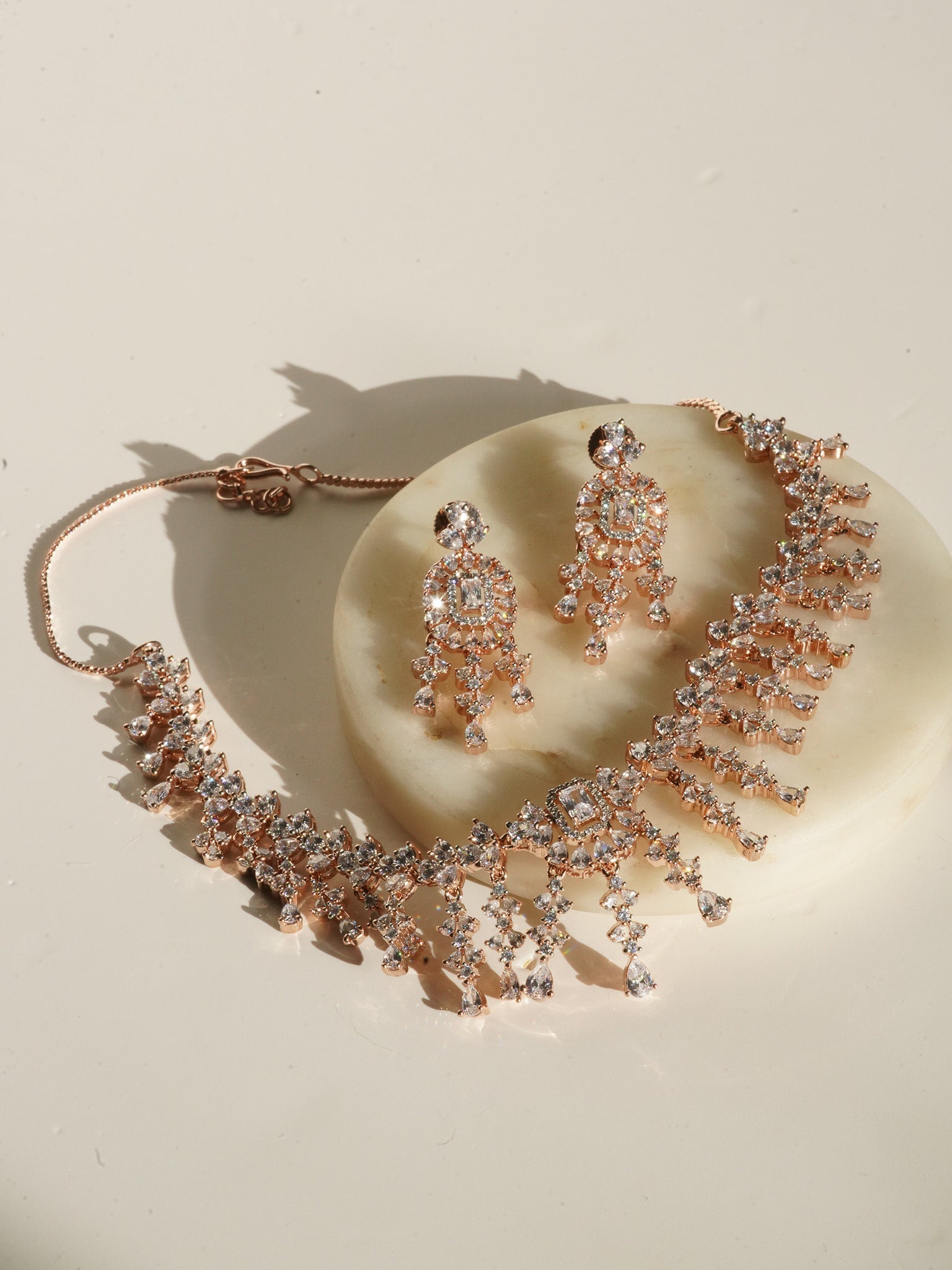 Anne Diamante Accent AD Necklace Set - Rose gold plated with cascading design, featuring diamante accent AD stones and matching dainty earrings, available in rose gold & white, rose gold & pink, rose gold & green, rose gold & sapphire blue, and rose gold & maroon.