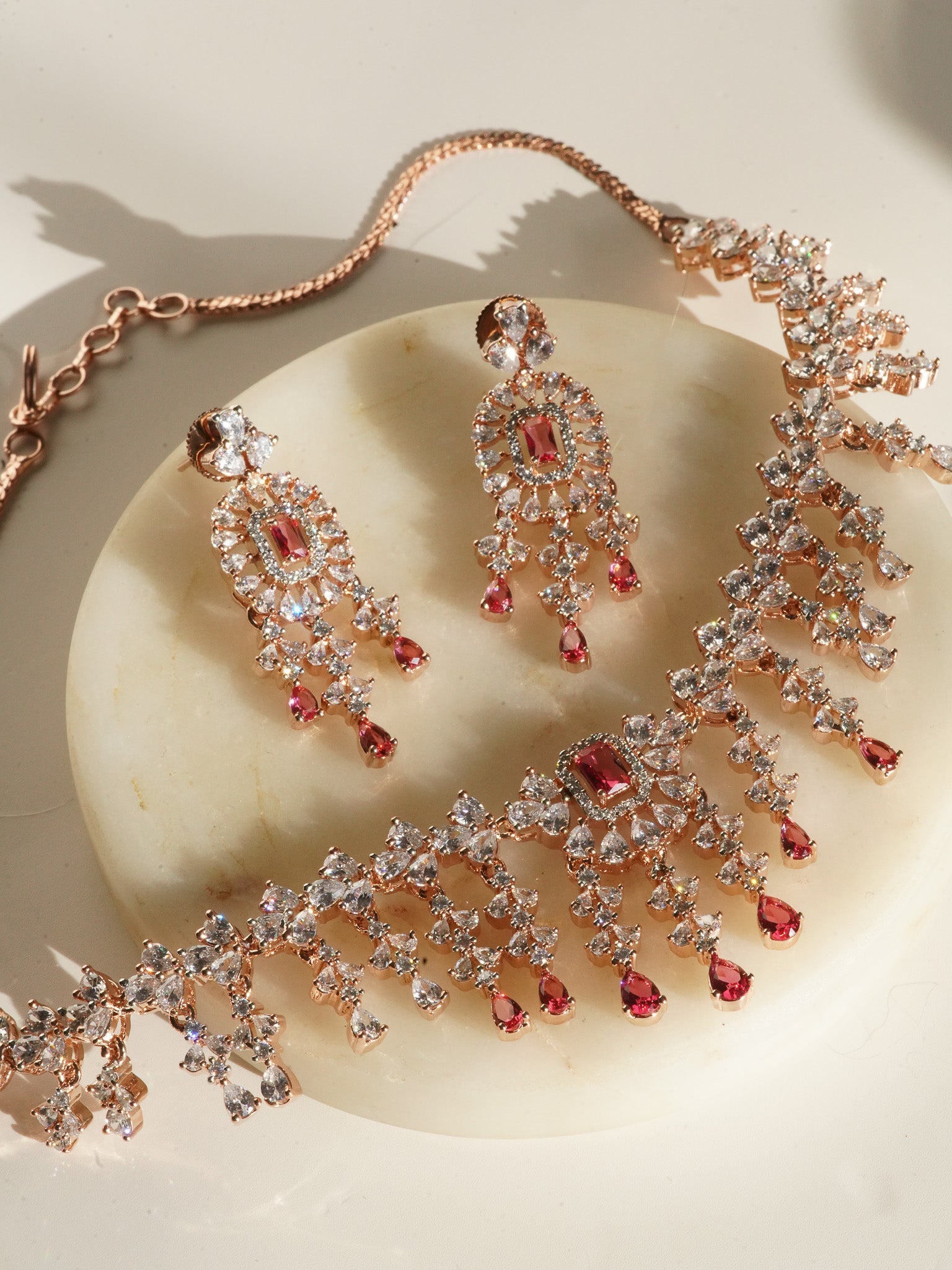 Anne Diamante Accent AD Necklace Set - Rose gold plated with cascading design, featuring diamante accent AD stones and matching dainty earrings, available in rose gold & white, rose gold & pink, rose gold & green, rose gold & sapphire blue, and rose gold & maroon.