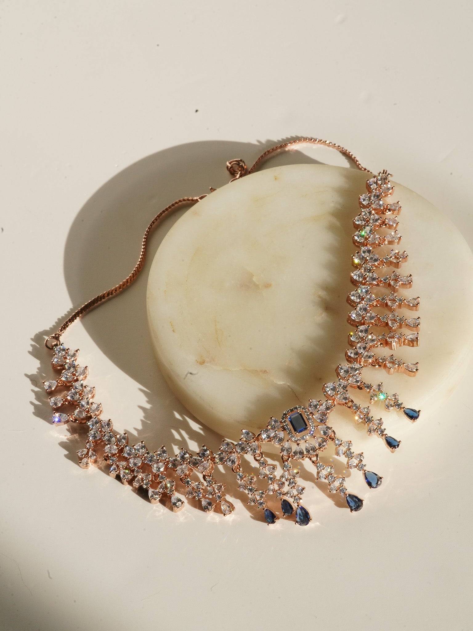 Anne Diamante Accent AD Necklace Set - Rose gold plated with cascading design, featuring diamante accent AD stones and matching dainty earrings, available in rose gold & white, rose gold & pink, rose gold & green, rose gold & sapphire blue, and rose gold & maroon.