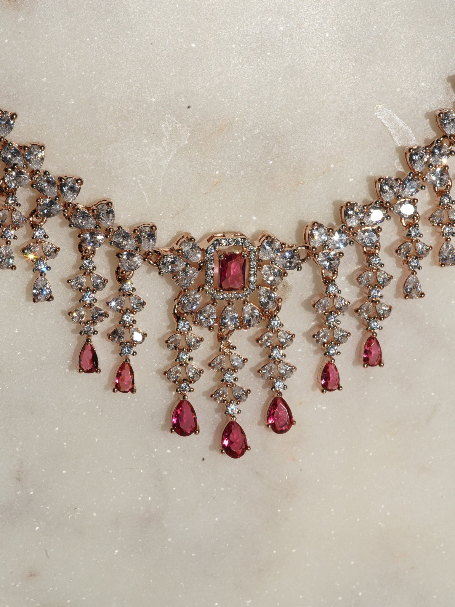 Anne Diamante Accent AD Necklace Set - Rose gold plated with cascading design, featuring diamante accent AD stones and matching dainty earrings, available in rose gold & white, rose gold & pink, rose gold & green, rose gold & sapphire blue, and rose gold & maroon.