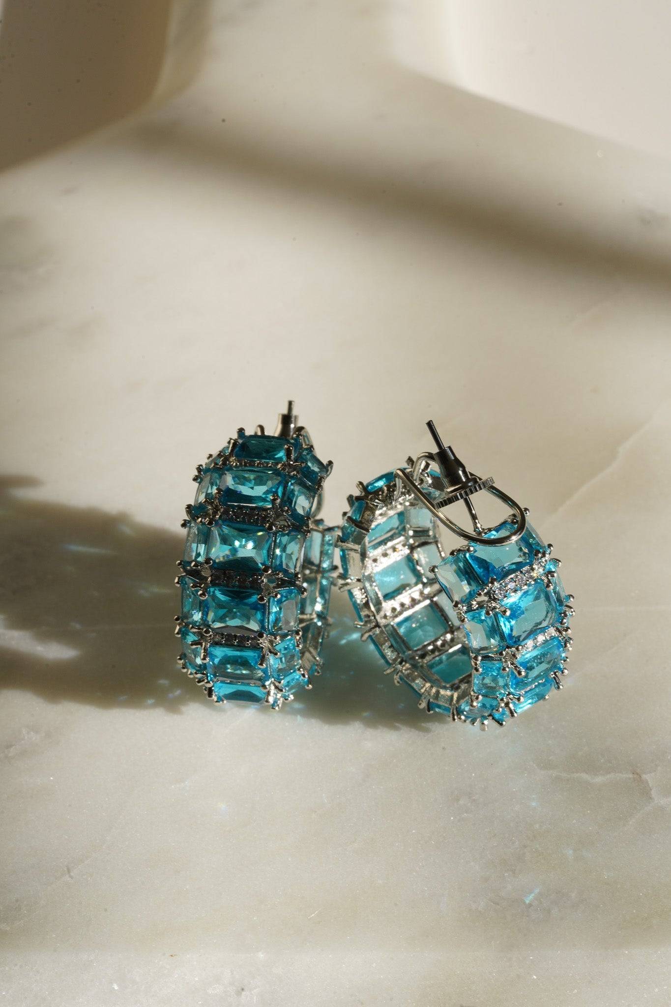 Azure Chunky AD Huggie Hoops - Rhodium-plated with Diamante accents, available in silver, yellow, teal, aqua, and light pink, featuring extra support backing.