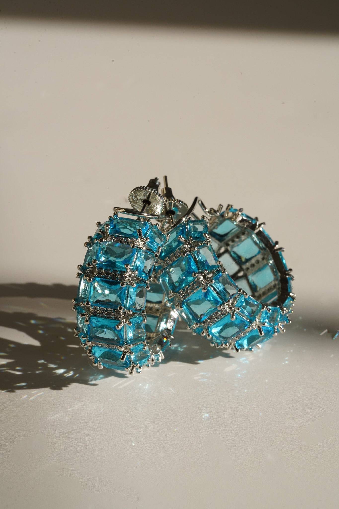 Azure Chunky AD Huggie Hoops - Rhodium-plated with Diamante accents, available in silver, yellow, teal, aqua, and light pink, featuring extra support backing.