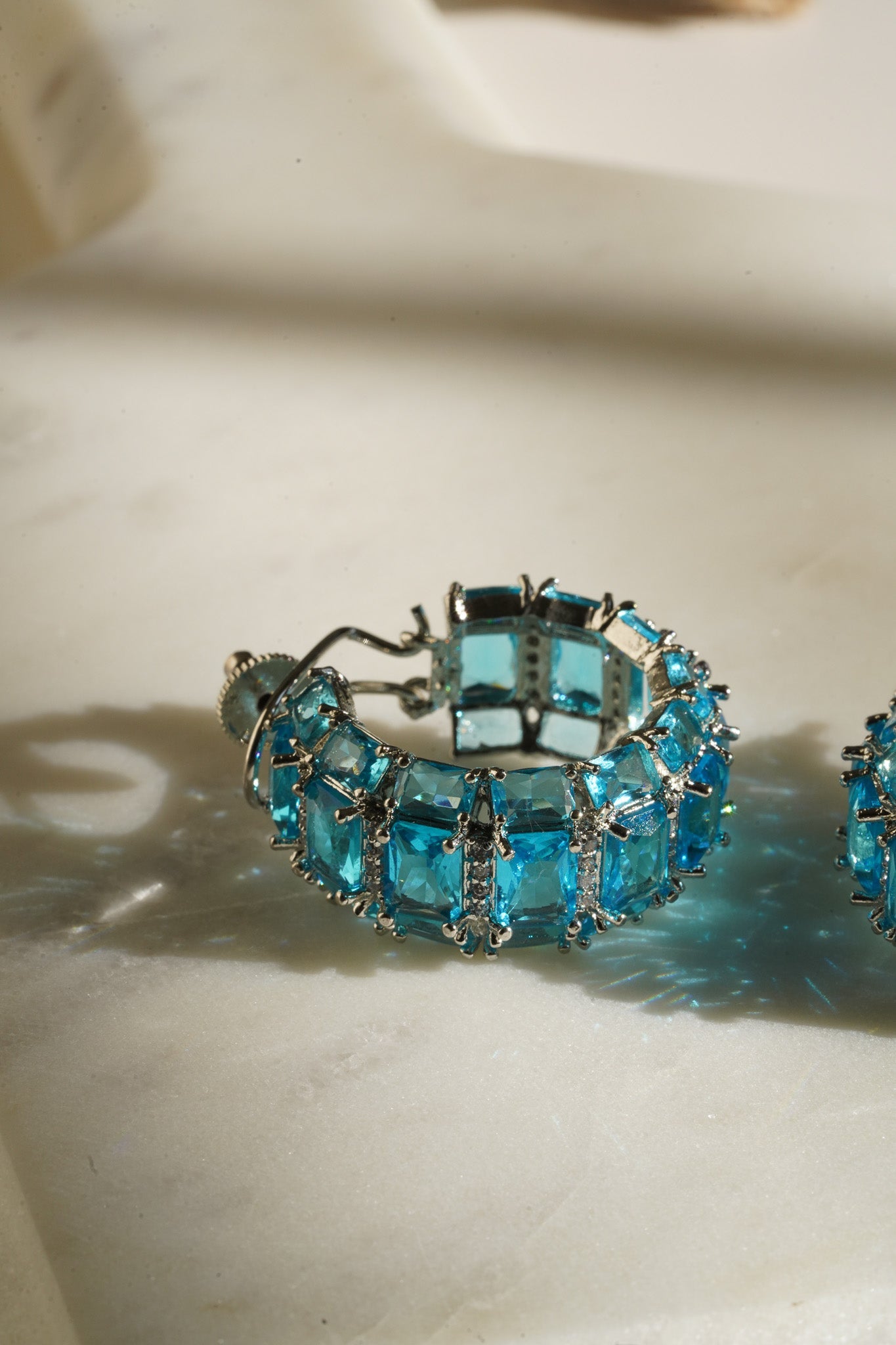Azure Chunky AD Huggie Hoops - Rhodium-plated with Diamante accents, available in silver, yellow, teal, aqua, and light pink, featuring extra support backing.