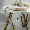 Chahat Necklace Set - Rhodium Floral AD in multicolor. Features vibrant floral pendant and matching earrings.