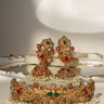 Chaya Navratan choker necklace and jhumka earrings set displayed on marble, featuring gold plating and colorful gemstones with pearl accents.