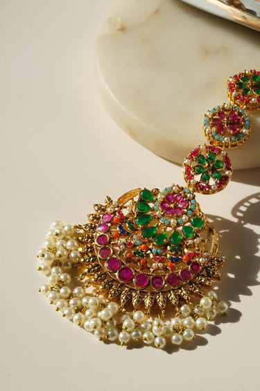 Detailed view of maang tikka from Inaya Earring & Maang Tikka Set - Statement | Chandbali with pink, green stones and pearls.