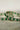 Ishani Rhodium Plated & Green AD Bangle Bracelet - Rhodium plated with cushion-cut green and white AD stones, set of two elegant bangle bracelets.