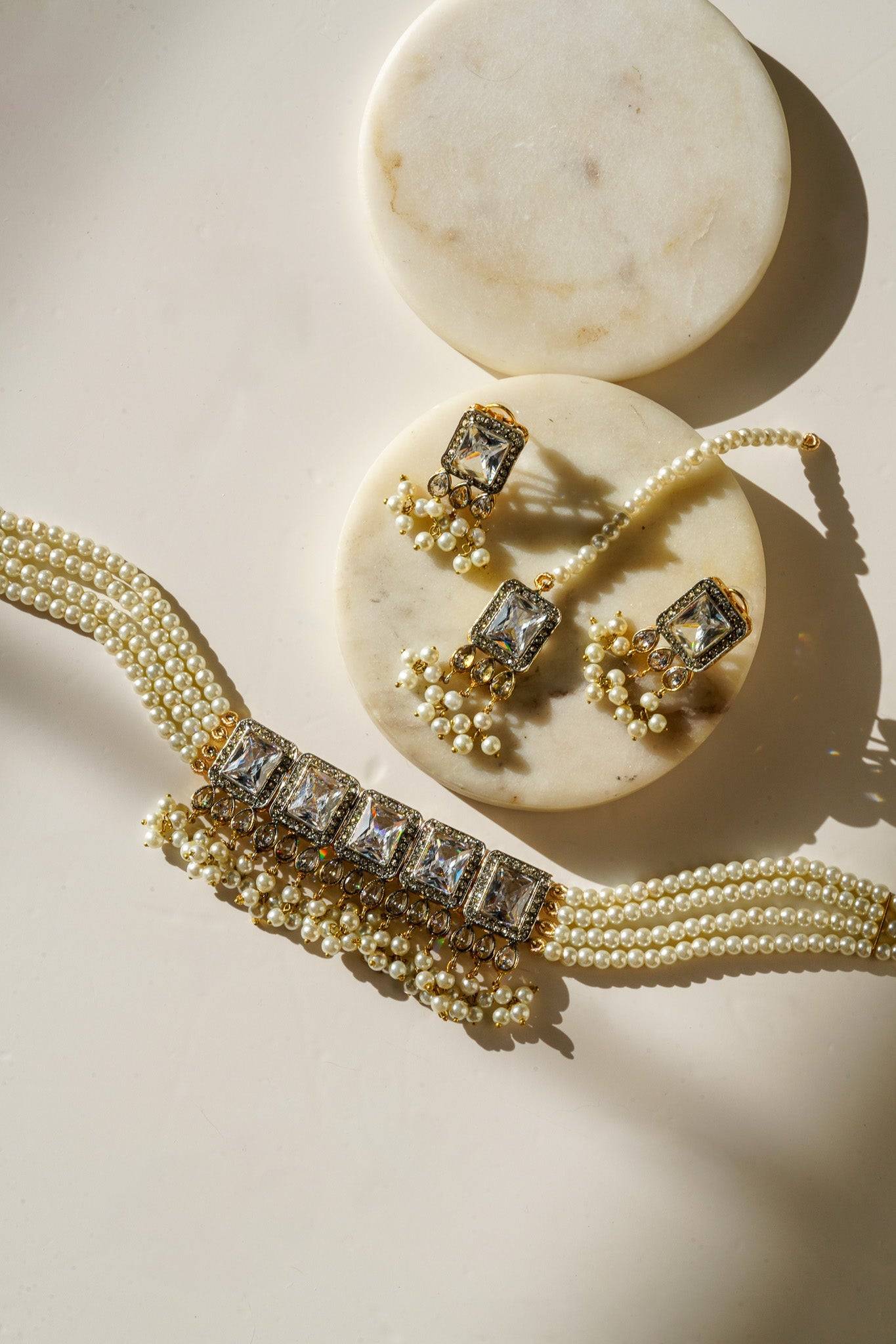 Jahanara Gold Plated Choker Necklace Set - Artisan crafted with cushion cut center stones, zircon rims, teardrop accents, 1.5" earrings, and a charming maang tikka.
