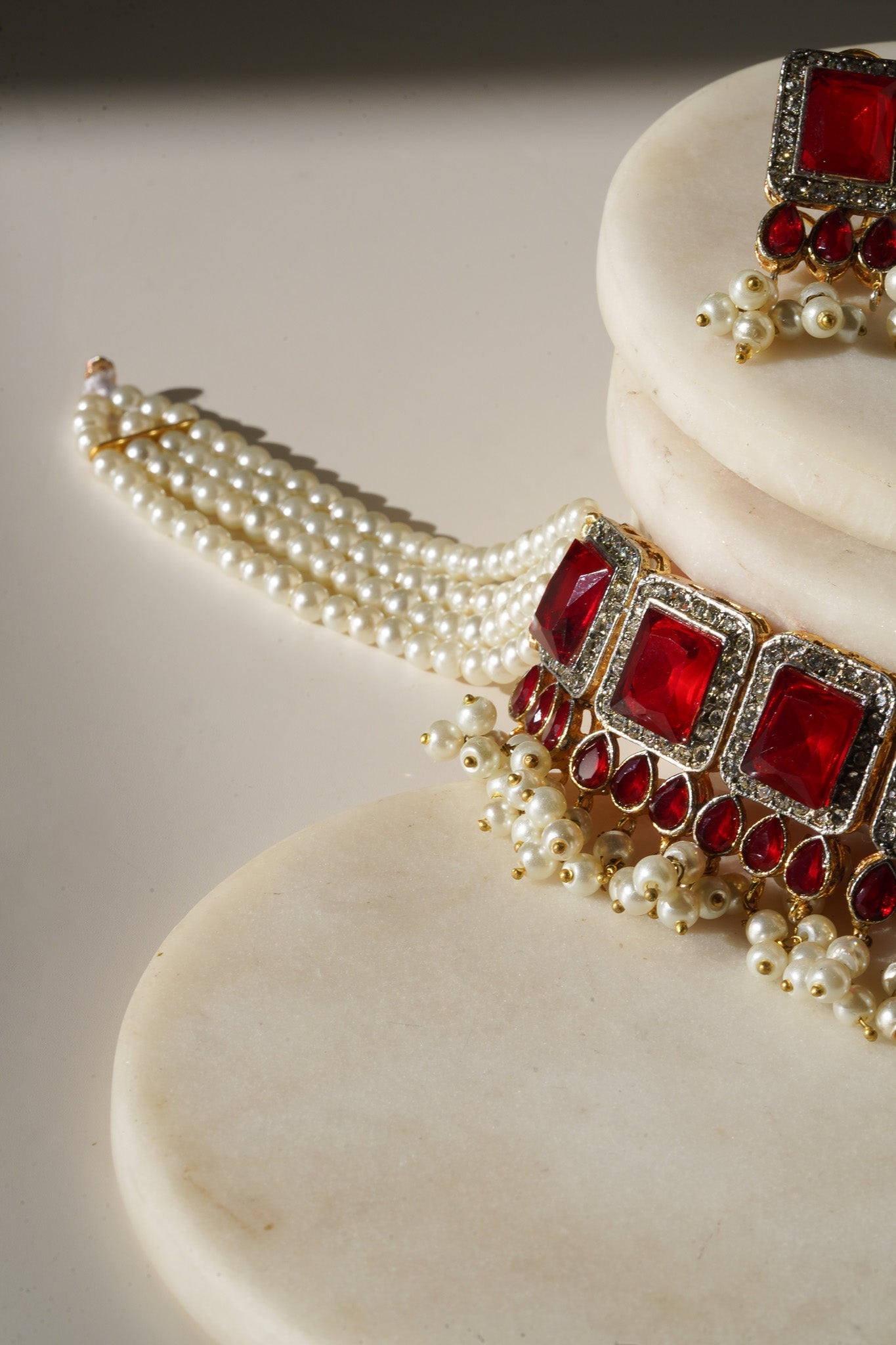 Jahanara Gold Plated Choker Necklace Set - Artisan crafted with cushion cut center stones, zircon rims, teardrop accents, 1.5" earrings, and a charming maang tikka.