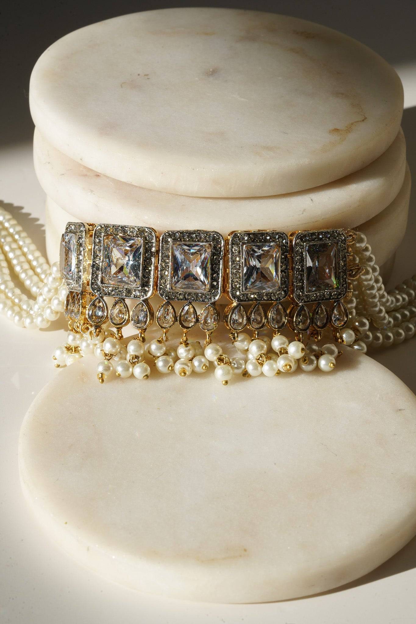 Jahanara Gold Plated Choker Necklace Set - Artisan crafted with cushion cut center stones, zircon rims, teardrop accents, 1.5" earrings, and a charming maang tikka.