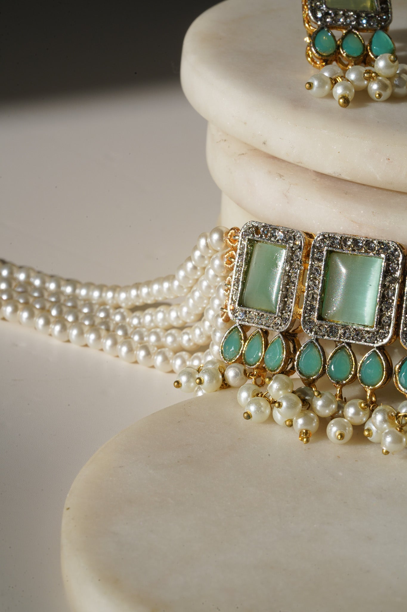 Jahanara Gold Plated Choker Necklace Set - Artisan crafted with cushion cut center stones, zircon rims, teardrop accents, 1.5" earrings, and a charming maang tikka.