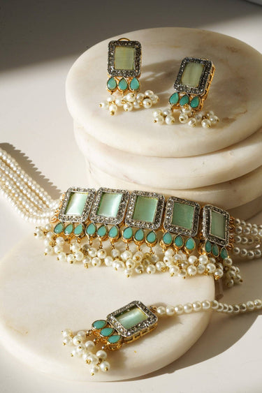 Jahanara Gold Plated Choker Necklace Set - Artisan crafted with cushion cut center stones, zircon rims, teardrop accents, 1.5" earrings, and a charming maang tikka.