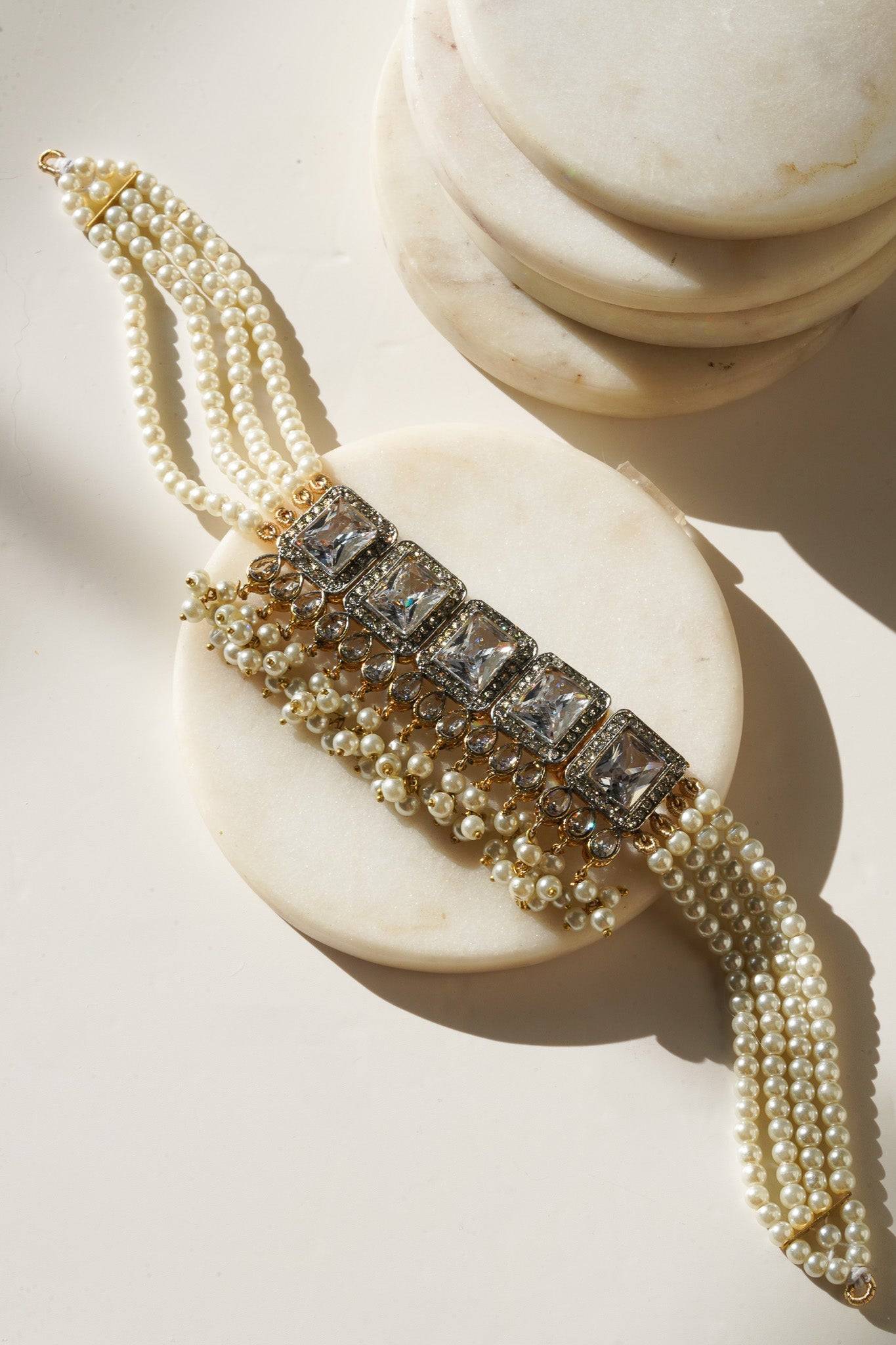 Jahanara Gold Plated Choker Necklace Set - Artisan crafted with cushion cut center stones, zircon rims, teardrop accents, 1.5" earrings, and a charming maang tikka.