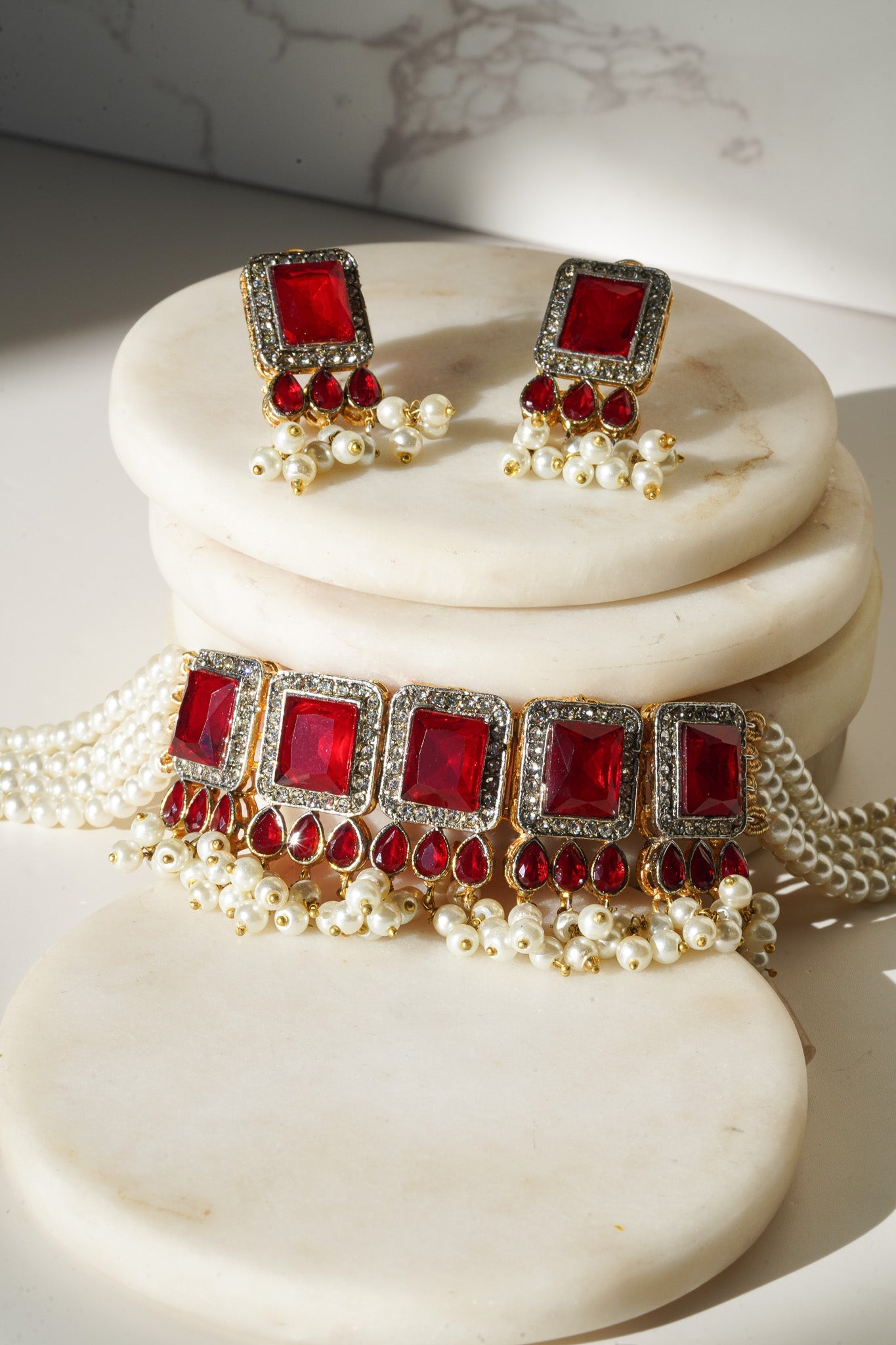 Jahanara Gold Plated Choker Necklace Set - Artisan crafted with cushion cut center stones, zircon rims, teardrop accents, 1.5" earrings, and a charming maang tikka.