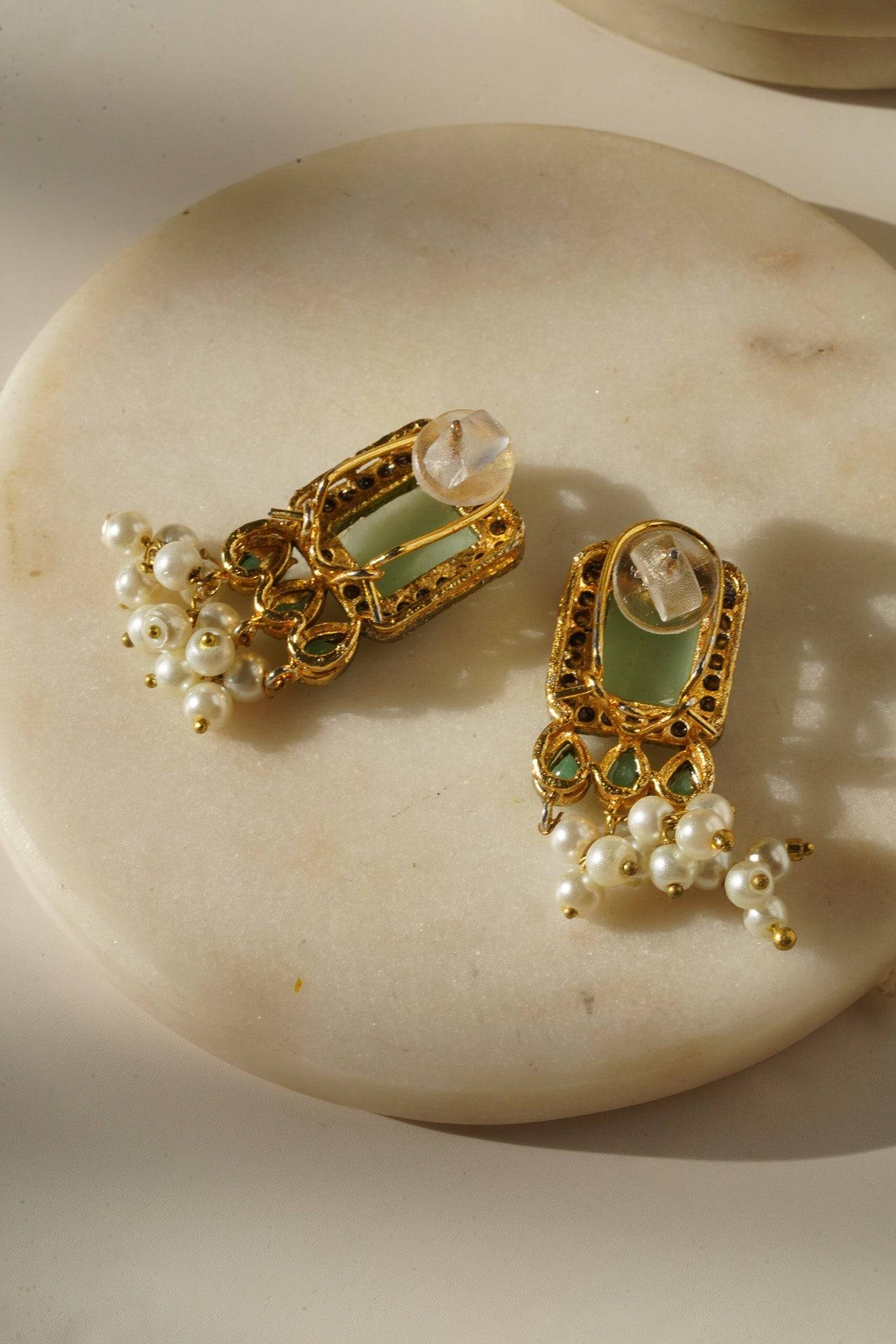 Jahanara Gold Plated Choker Necklace Set - Artisan crafted with cushion cut center stones, zircon rims, teardrop accents, 1.5" earrings, and a charming maang tikka.