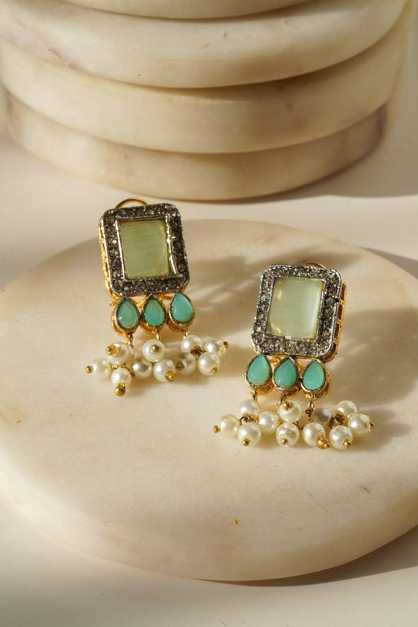 Jahanara Gold Plated Choker Necklace Set - Artisan crafted with cushion cut center stones, zircon rims, teardrop accents, 1.5" earrings, and a charming maang tikka.