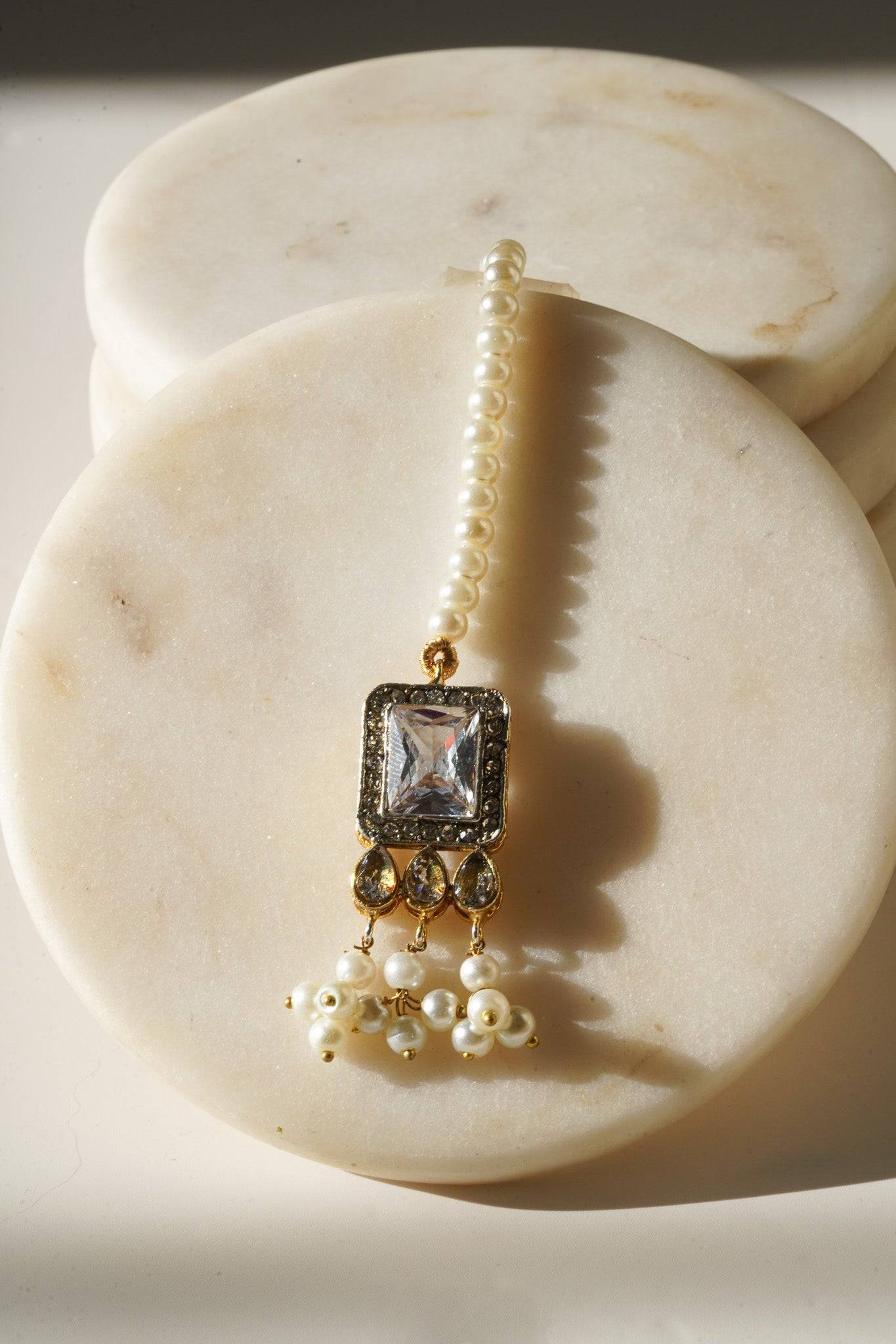 Jahanara Gold Plated Choker Necklace Set - Artisan crafted with cushion cut center stones, zircon rims, teardrop accents, 1.5" earrings, and a charming maang tikka.
