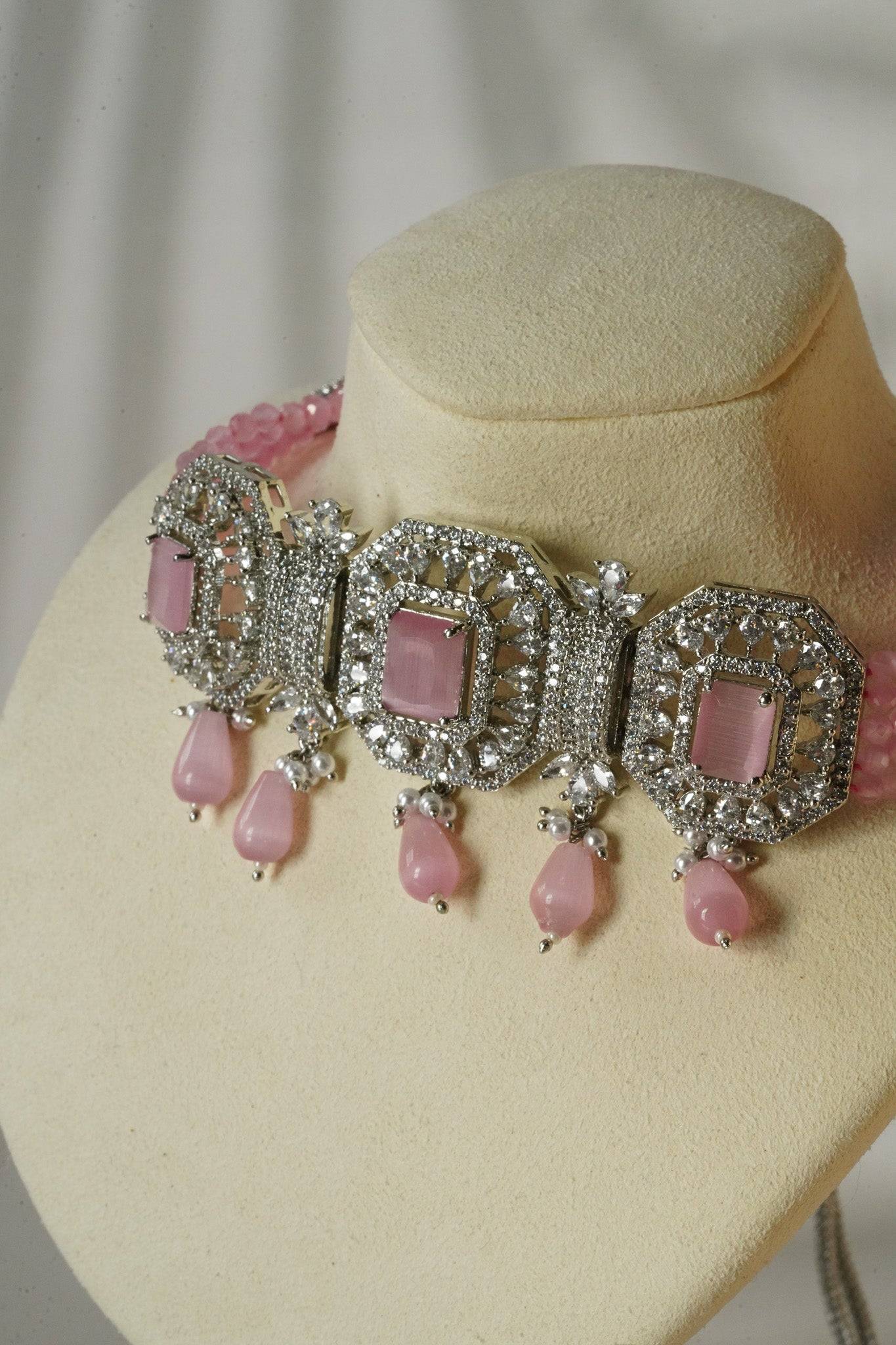 Jhanvi Choker Necklace Set - Silver & Gem Variations featuring cushion-cut AD stones with pink teardrop accents, includes matching earrings.