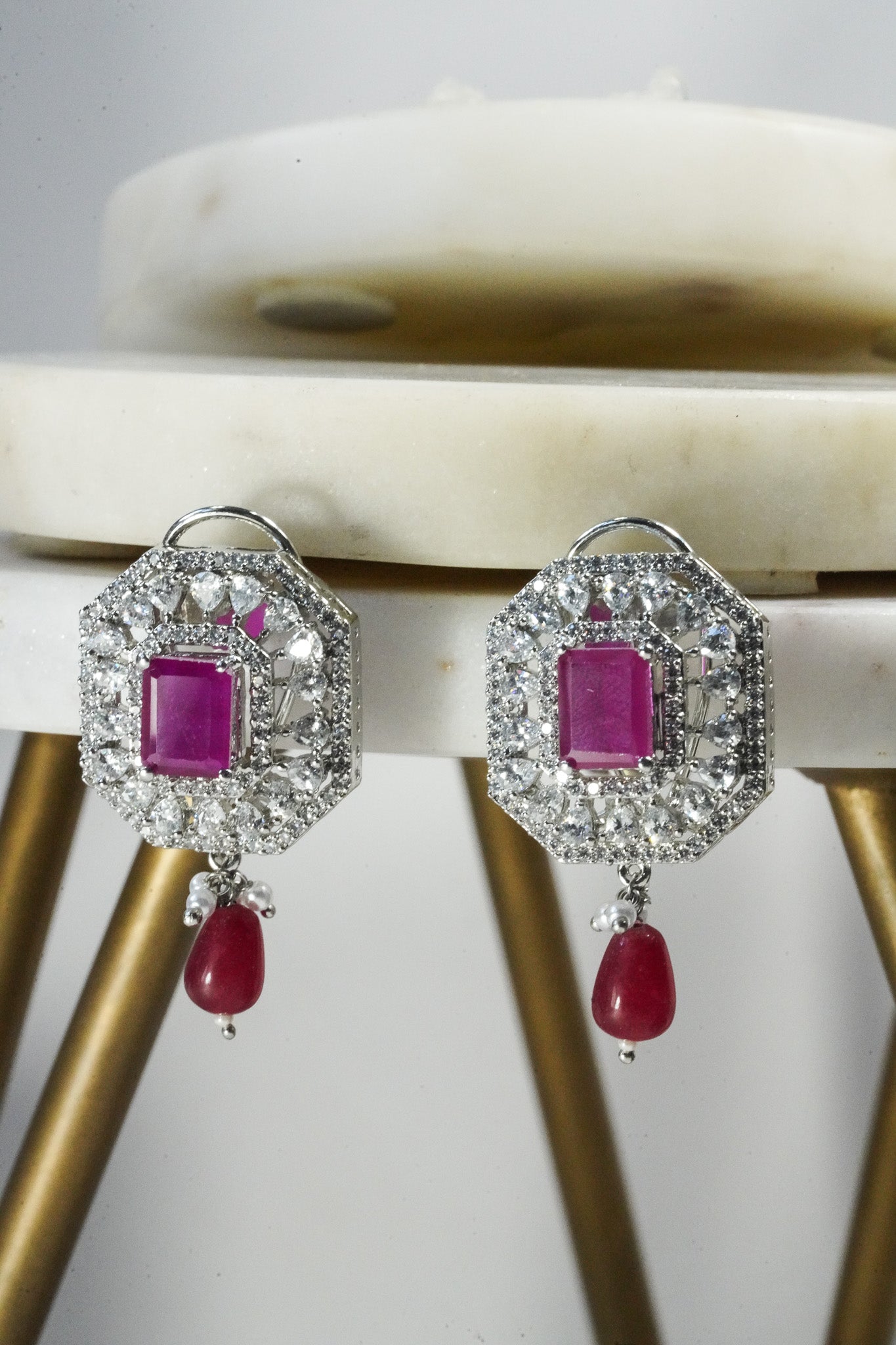 Jhanvi Choker Necklace Set - Silver & Gem Variations featuring cushion-cut AD stones with ruby teardrop accents, includes matching earrings.