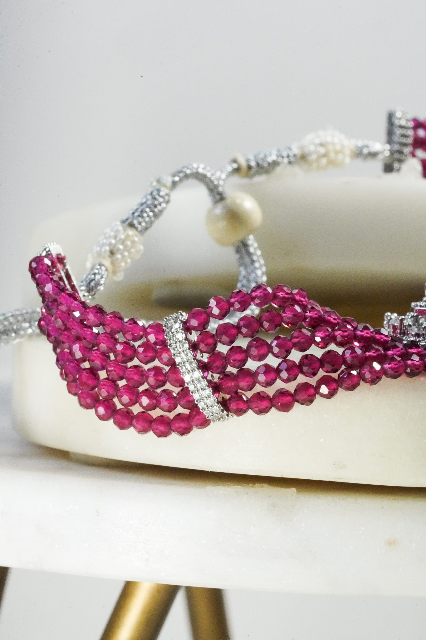 Jhanvi Choker Necklace Set - Silver & Gem Variations featuring cushion-cut AD stones with ruby teardrop accents, includes matching earrings.